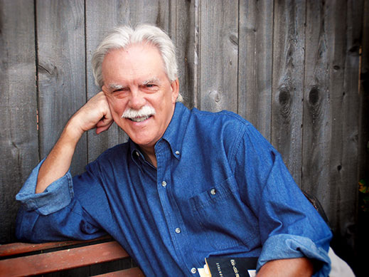 Kevin Clark Portrait in Blue Shirt on Bench