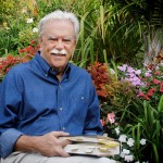 Kevin Clark Portrait in Blue Shirt with Book